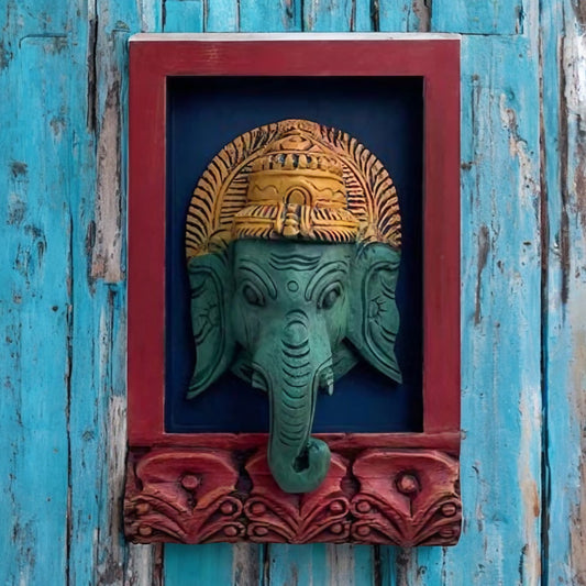 Handcrafted Ganesha wall hanging with red frame, antique wooden décor, perfect for rustic and vintage wall art enthusiasts