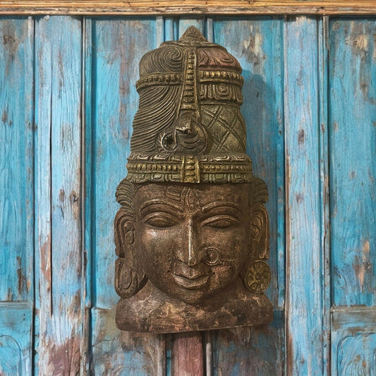 Handcrafted wooden wall art featuring Lord Shiva's face with intricate carvings and antique brown finish, ideal for spiritual home decor