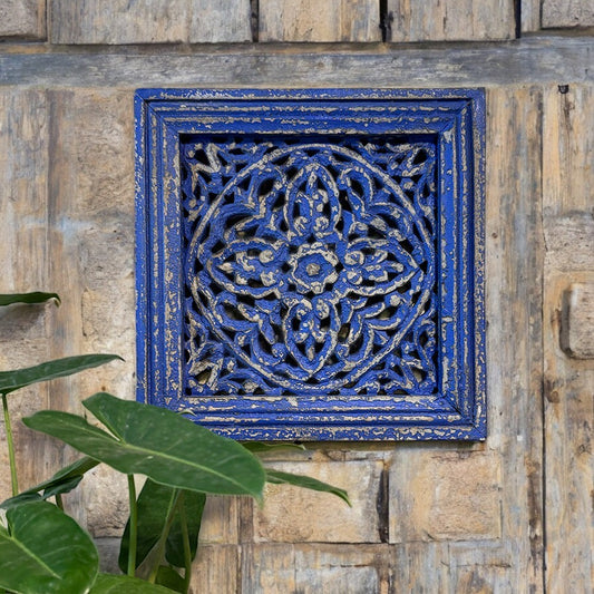 Handmade vintage blue carved panel with intricate floral carvings, distressed finish, and rustic wooden frame, perfect for wall décor.