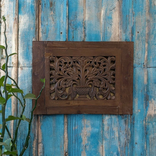 Hand-carved wooden panel for vintage wall art and decor.