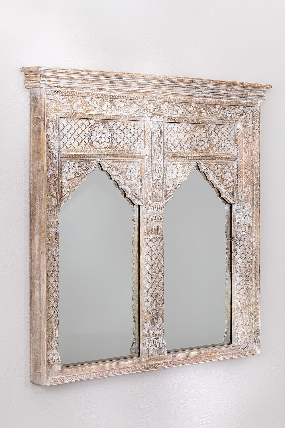 White antique mirror featuring distressed detailing and traditional Jharokha carvings, perfect as a decorative wall mirror.