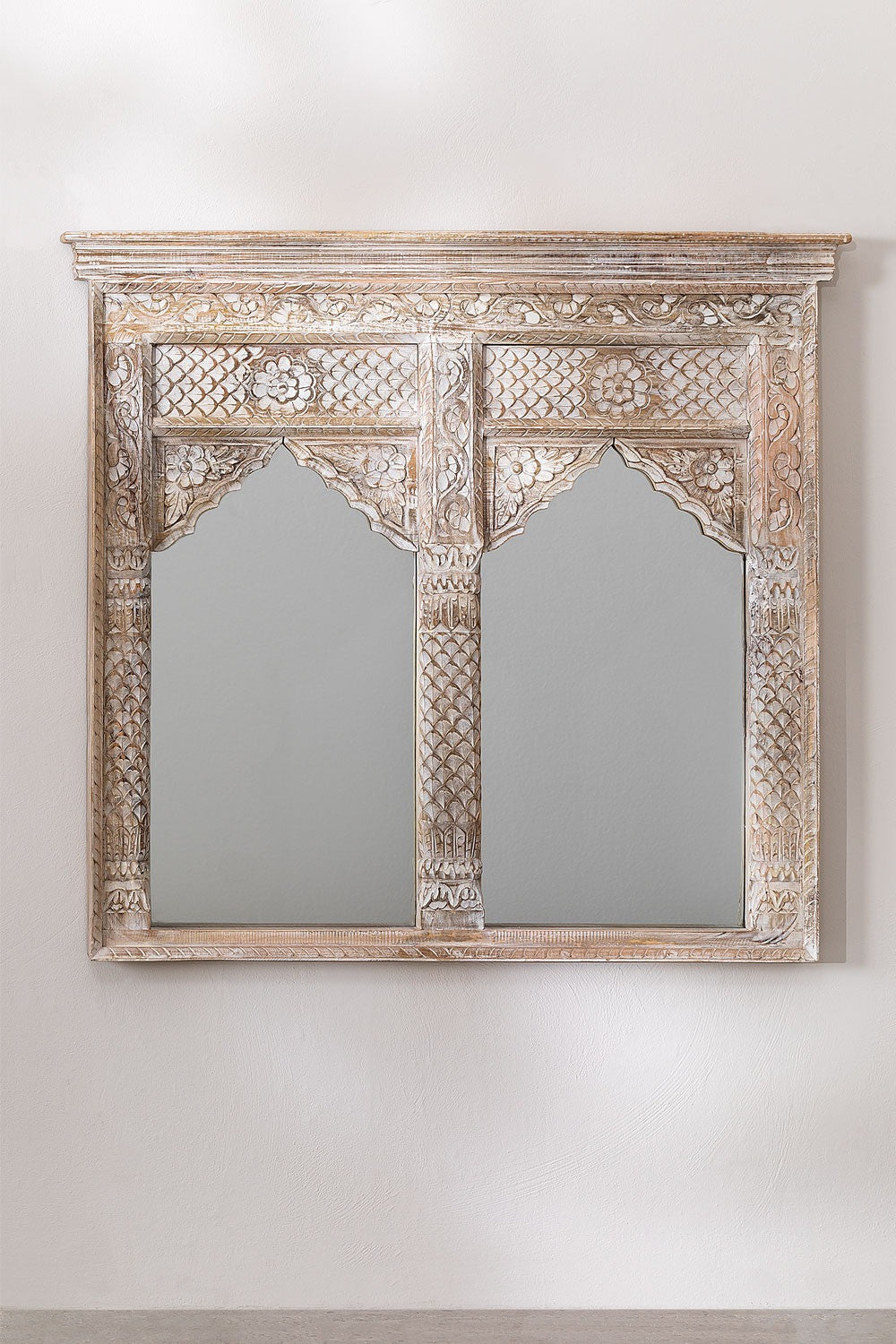 Framed mirrors with whitewashed wood detailing, combining vintage aesthetics with functional decor for any space.