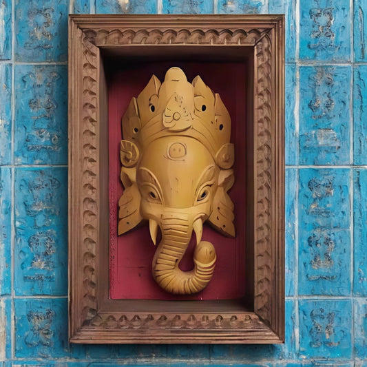 Wooden carved Ganesha wall decor in a handcrafted frame, featuring traditional Indian design, ideal for pooja rooms and antique home decor.